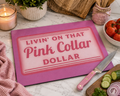 living on that pink collar dollar glass cutting board
